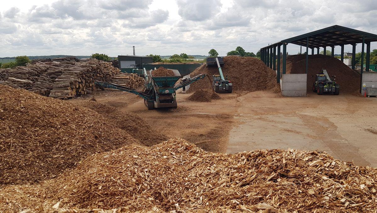 Illustrative biomass material-handling facility representing the type of operation under consideration, not GIGOC’s completed facility.